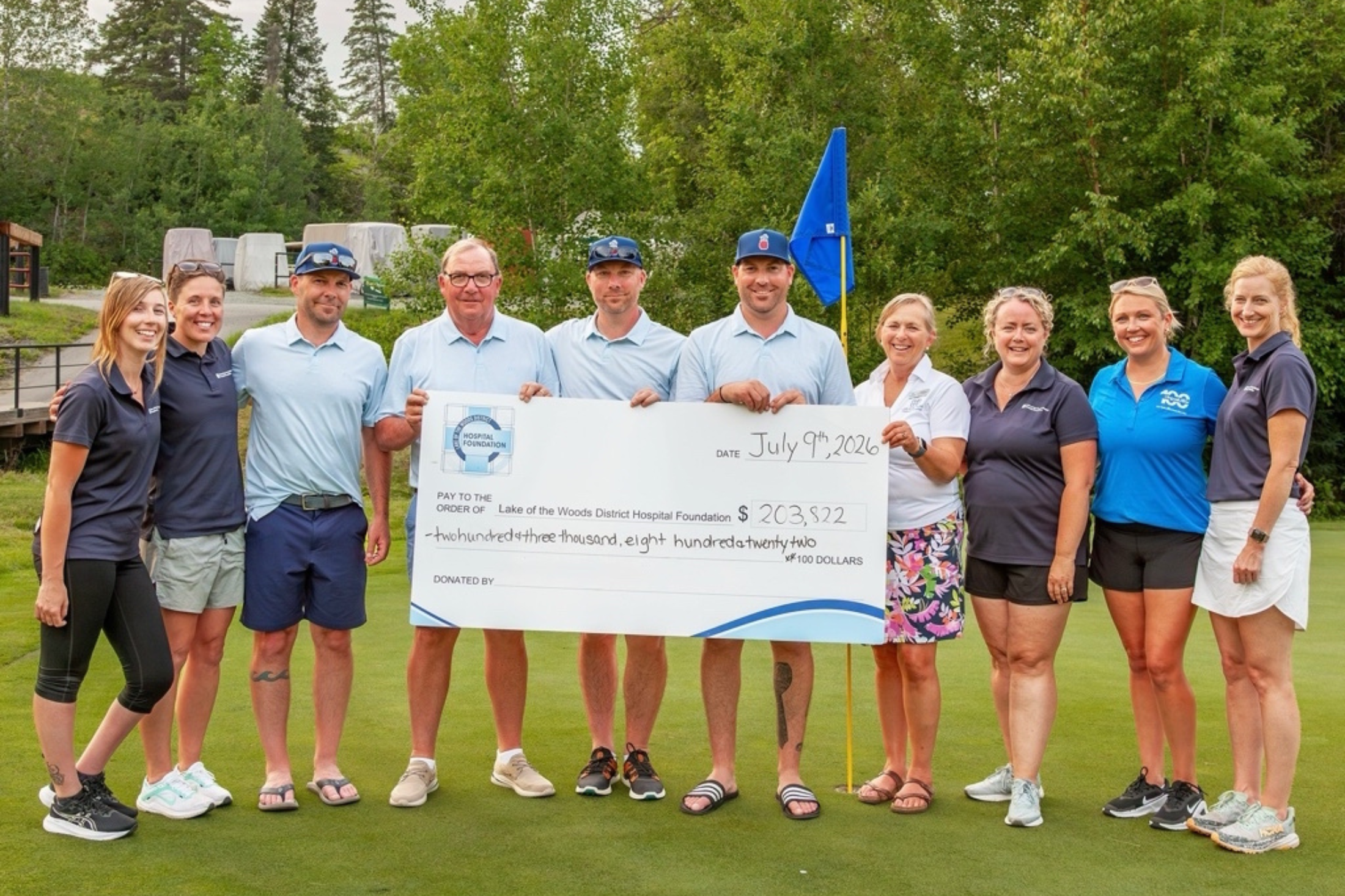 People present the proceeds from the Par 3 Charity Challenge, driven by The Dingwall Group