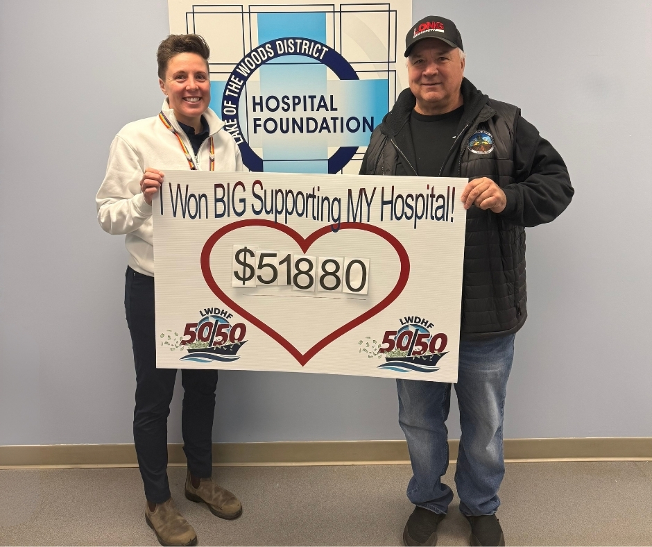 Mark Parker of Kenora celebrates winning the Holiday 50/50